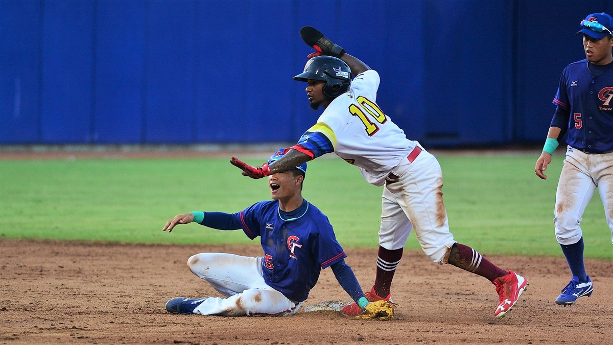 Machado, Romero come up with big hits. Venezuela will play the third place game